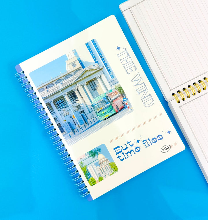 Notebook with scenic cover on a blue background